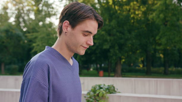istock Young Man Walking and Using a Phone in Town 1078143560