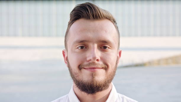 istock Young Man Wearing a White Shirt Smiling in Town 1078144608