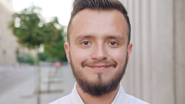 istock Young Man Wearing a White Shirt Smiling in Town 1078145688