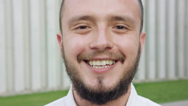 istock Young Man Wearing a White Shirt Smiling in Town 1078146800