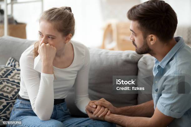 Caring Husband Hold Wife Hand Making Peace After Fight Stock Photo - Download Image Now