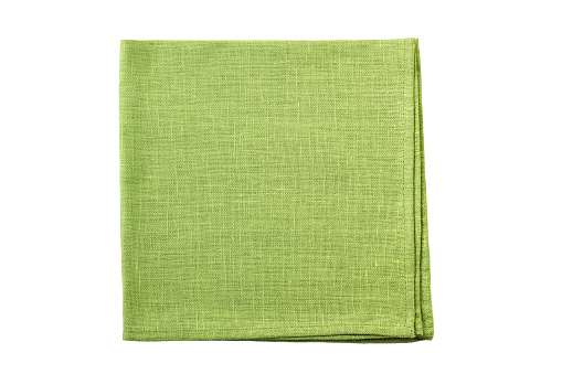 Pale green folded textile napkin isolated on white background