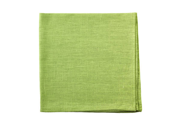 Pale green folded textile napkin on white stock photo