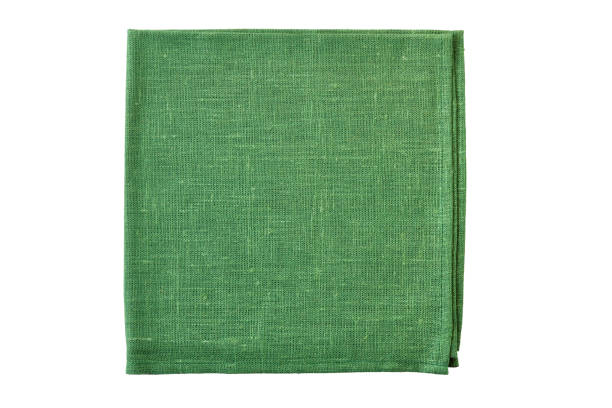 istock Folded green natural textile napkin on white 1078160124