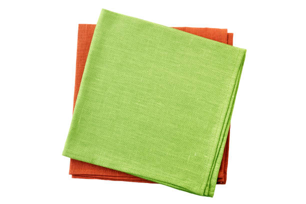 istock Stack of pale green and red folded napkins on white 1078160250