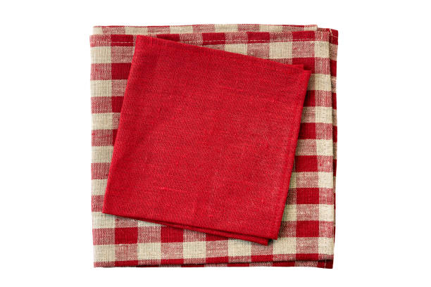 istock Stack of red and checkered textile napkins on white 1078160468
