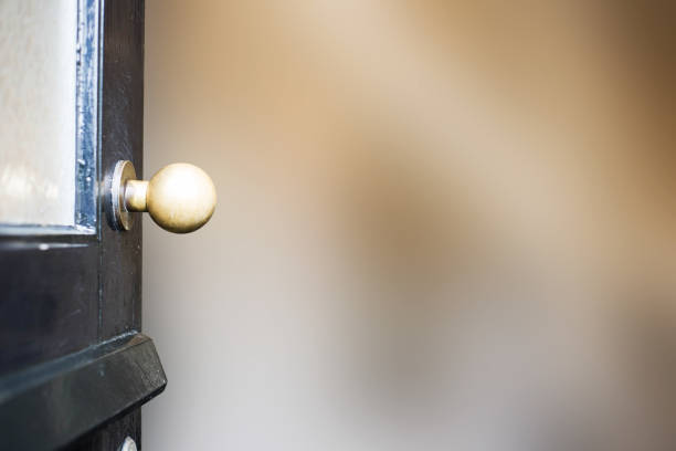 istock Open front door close-up to new home blurred background 1078161814