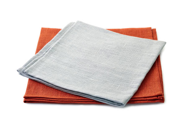 istock Folded gray and brown textile napkins stacked on white background 1078162408