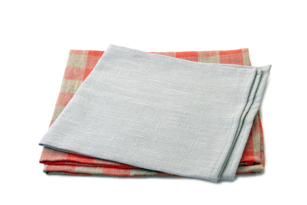 istock Folded gray and red-checkered textile napkins stacked on white 1078162466