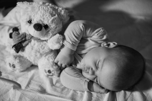 istock Black and white image of resting baby boy 1078162768