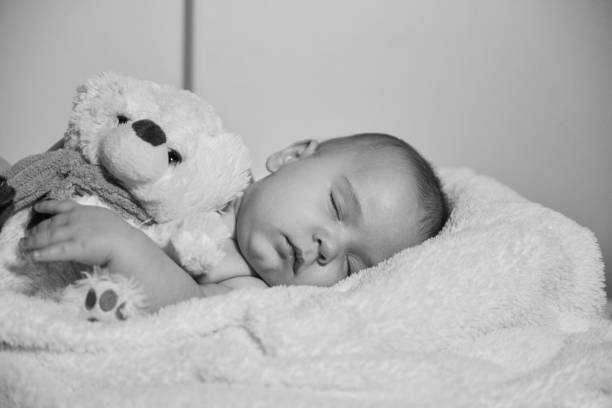istock Black and white image of resting baby boy 1078162774