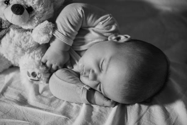 istock Black and white image of resting baby boy 1078162778