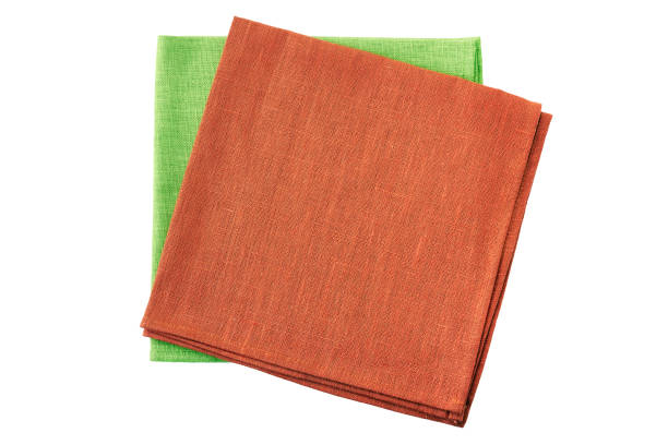 istock Stack of red and pale green folded napkins on white 1078162906