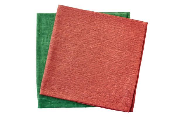 istock Stack of red and green folded napkins on white 1078162960