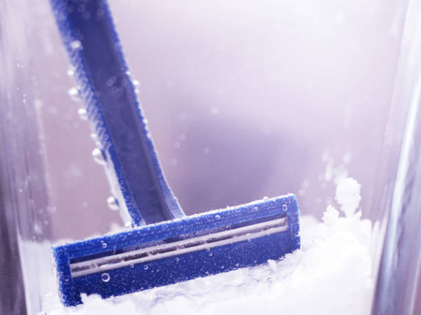 istock blue disposable razor in water with bubbles 1078166870