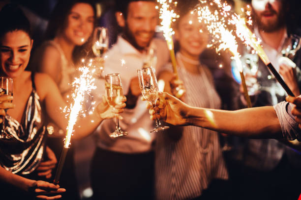 Toasting to this lovely night Group of friends toasting in the club party stock pictures, royalty-free photos & images