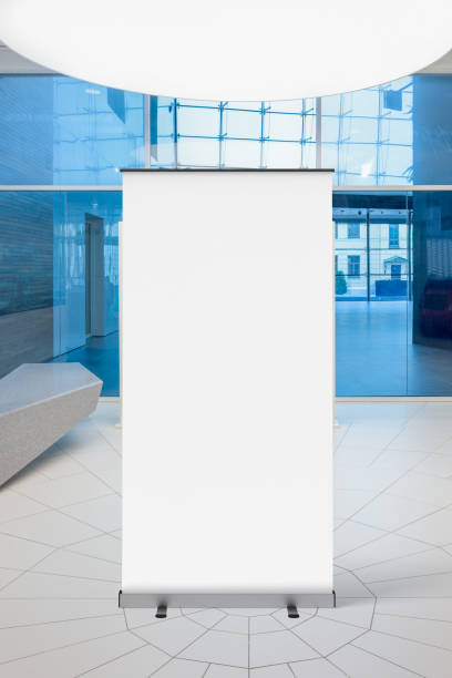 istock Blank roll up banner stand in contemporary office interior 1078167892
