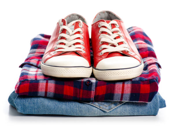 istock Stack of clothes and red sneakers 1078168472