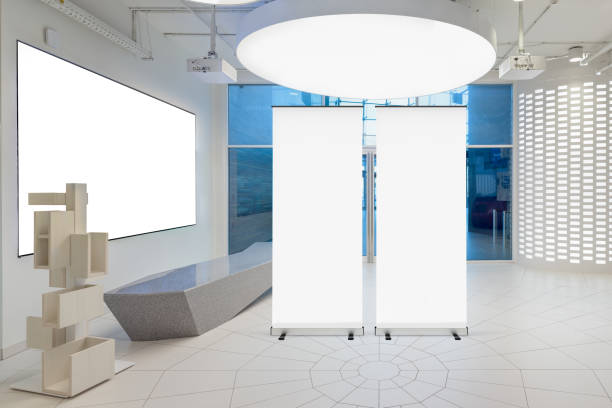 istock Blank roll up banner stand in contemporary office interior 1078168796