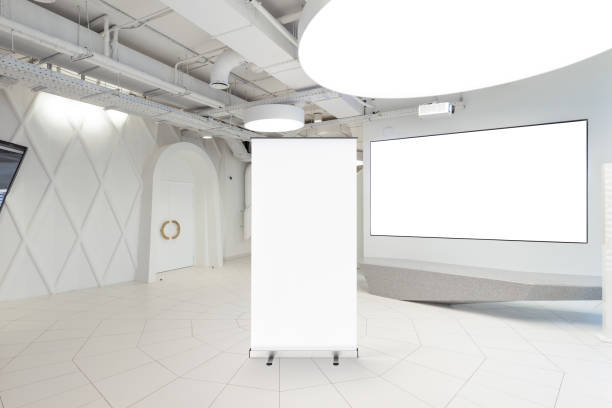 istock Blank roll up banner stand in contemporary office interior 1078168842