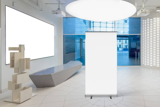 istock Blank roll up banner stand in contemporary office interior 1078168898
