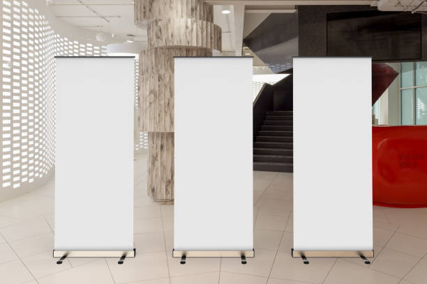 istock Blank roll up banner stand in contemporary office interior 1078168978