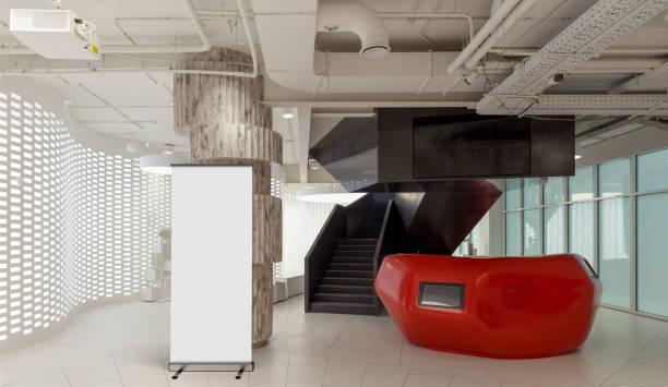istock Blank roll up banner stand in contemporary office interior 1078169018