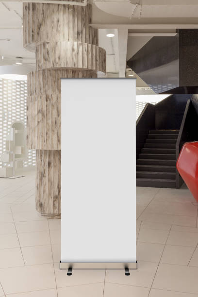 istock Blank roll up banner stand in contemporary office interior 1078169052