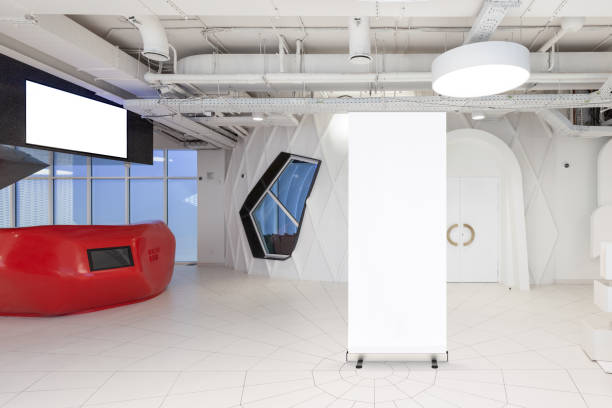 istock Blank roll up banner stand in contemporary office interior 1078169354