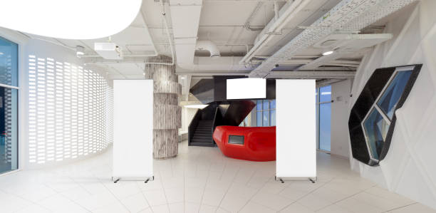 istock Blank roll up banner stand in contemporary office interior 1078169434