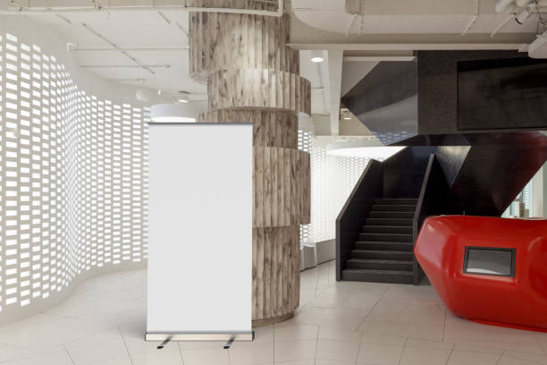 istock Blank roll up banner stand in contemporary office interior 1078169456