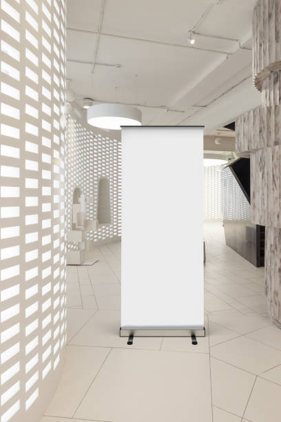 istock Blank roll up banner stand in contemporary office interior 1078169458