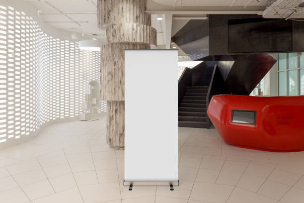 istock Blank roll up banner stand in contemporary office interior 1078169484