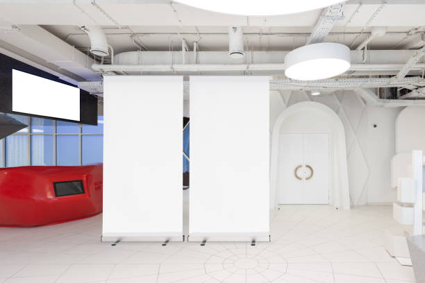 istock Blank roll up banner stand in contemporary office interior 1078169628