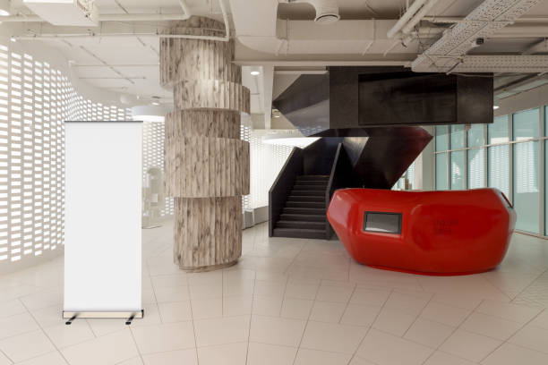 istock Blank roll up banner stand in contemporary office interior 1078169648