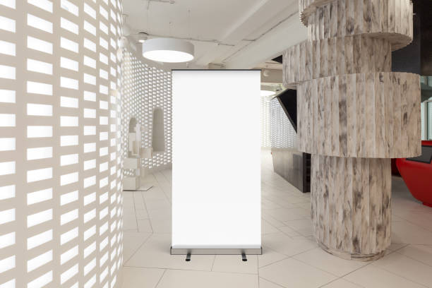 istock Blank roll up banner stand in contemporary office interior 1078169822