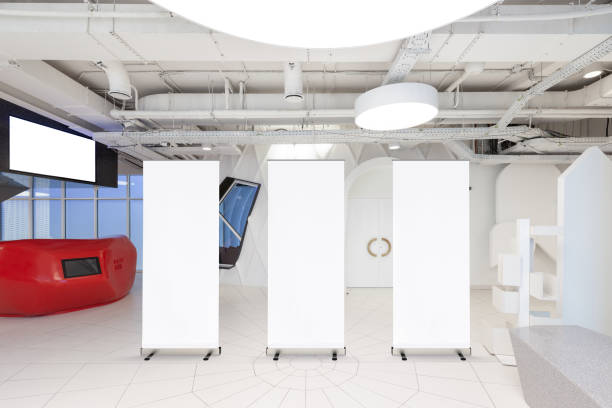 istock Blank roll up banner stand in contemporary office interior 1078169848
