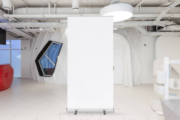 istock Blank roll up banner stand in contemporary office interior 1078169936