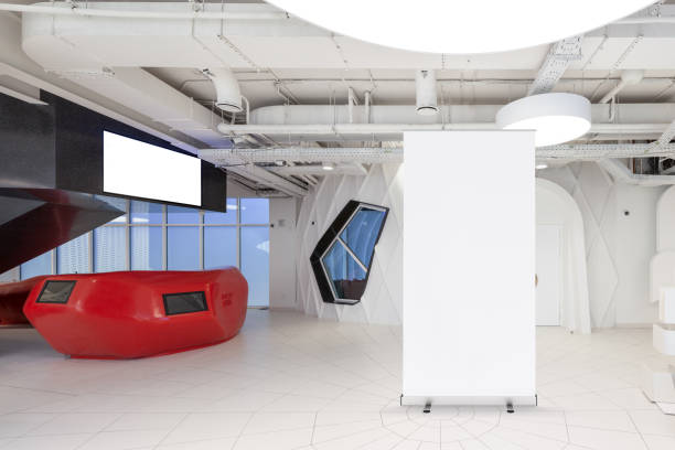 istock Blank roll up banner stand in contemporary office interior 1078170060