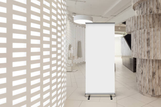 istock Blank roll up banner stand in contemporary office interior 1078171240