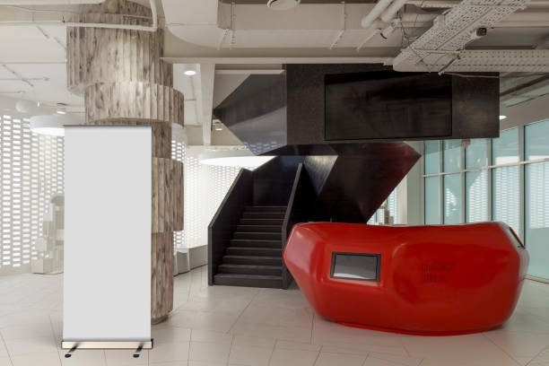 istock Blank roll up banner stand in contemporary office interior 1078171266