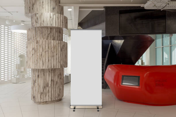 istock Blank roll up banner stand in contemporary office interior 1078171294