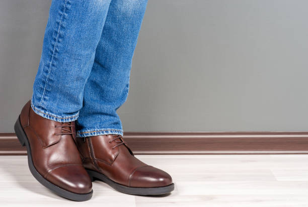 istock Boots men on white wooden 1078177220