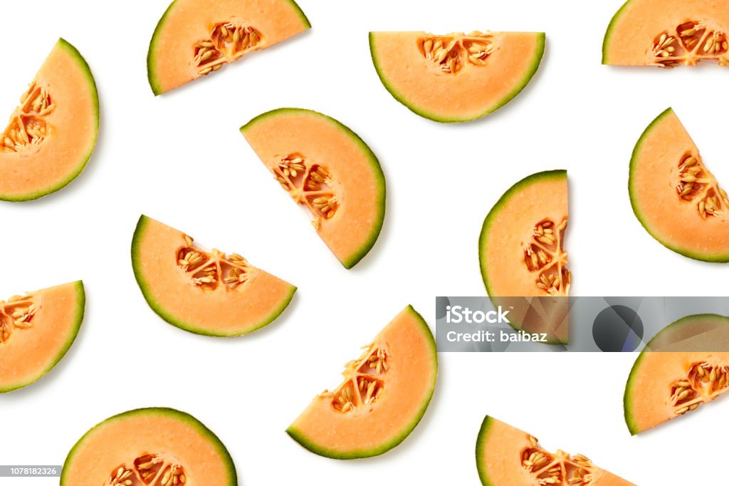 Fruit pattern of melon slices Fruit pattern of melon slices isolated on white background. Top view. Flat lay Melon Stock Photo