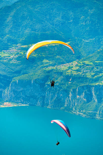 istock Paragliding over lake garda 1078183706