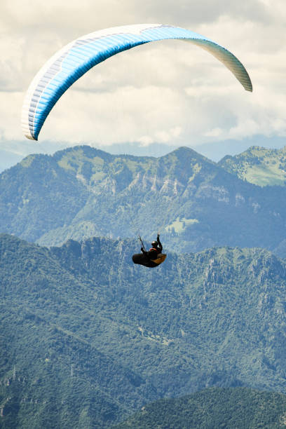 istock Paragliding over lake garda 1078183886