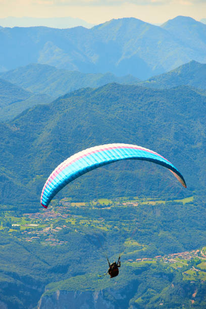 istock Paragliding over lake garda 1078184450
