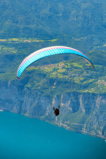 istock Paragliding over lake garda 1078184472