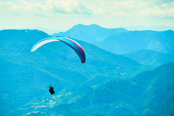 istock Paragliding over lake garda 1078184516