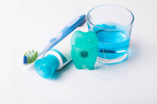 Tools for dental care: orthodontic brush, floss, toothpaste. Invisible dental aligners modern tooth brackets transparent braces to straighten teeth in cosmetic dentistry and orthodontics